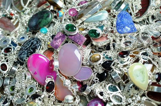 gemstone necklaces in a pile