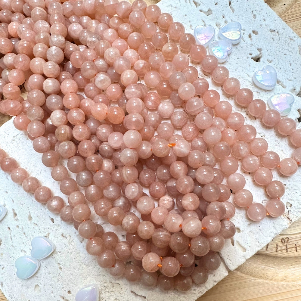6mm round peach moonstone beads, glossy, 1 strand, 16 inches, approx. 65 beads.