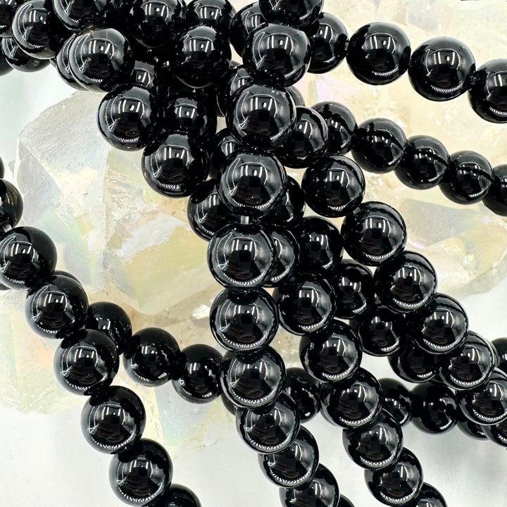 black onyx, 6mm, round, glossy, 1 strand, 16 inches, approx. 66 beads.