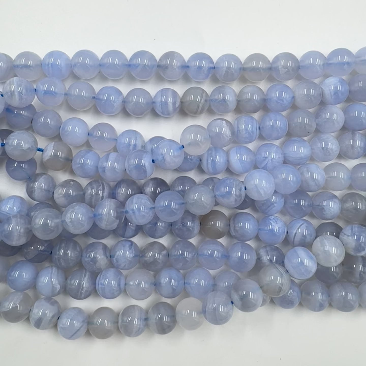 Stunning Blue Lace Agates in round and high quality dagger shapes, on elastic with single sterling tube bead